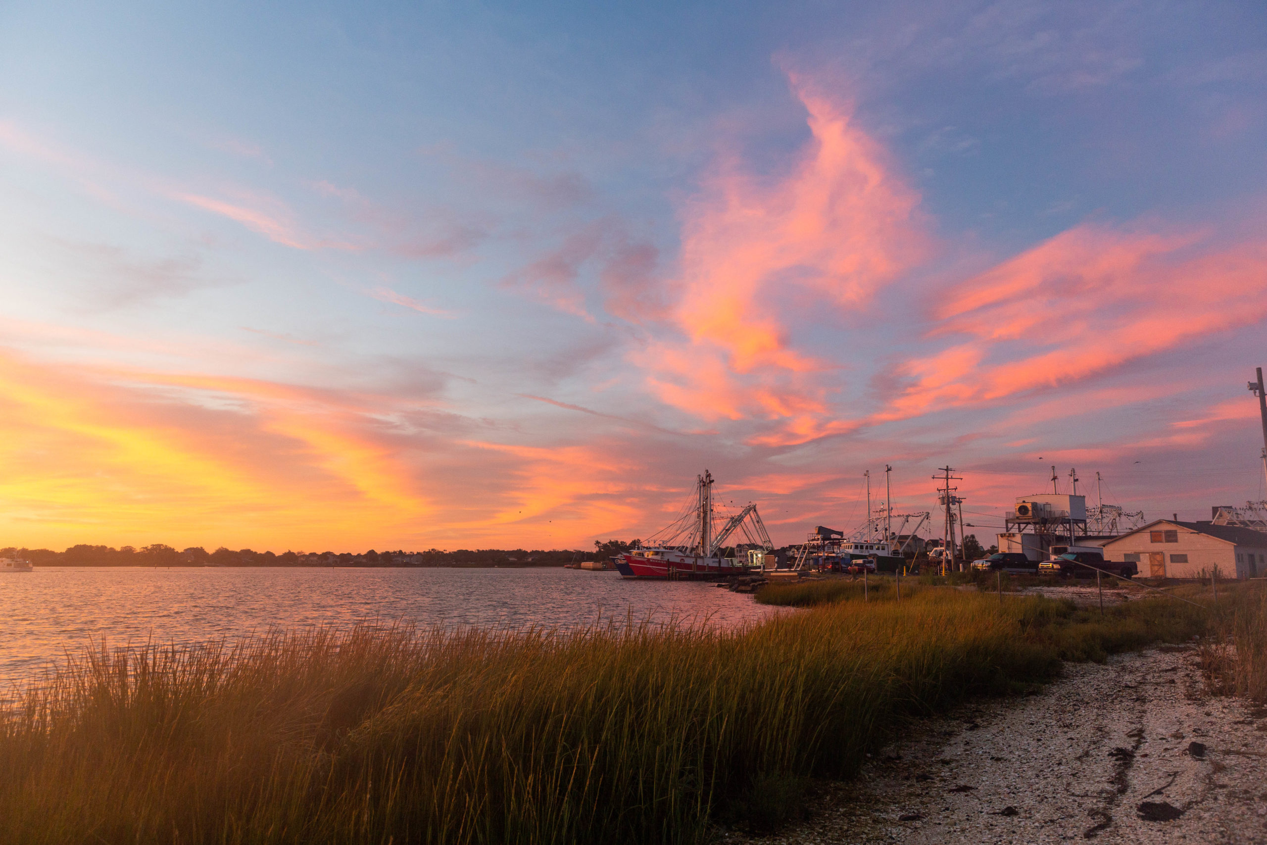 Fishing boats and salt marsh at sunrise