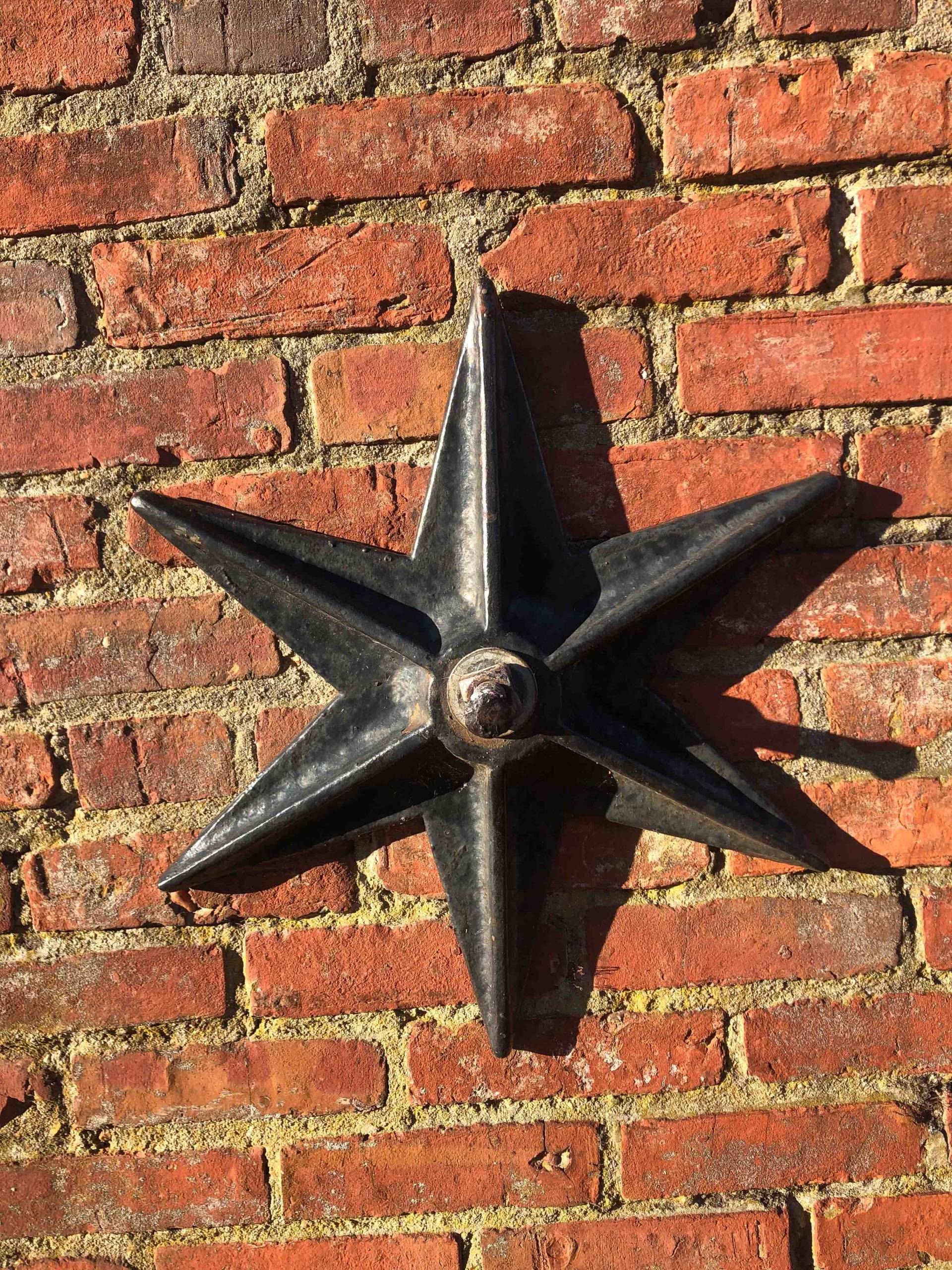 star bolt in brick wall