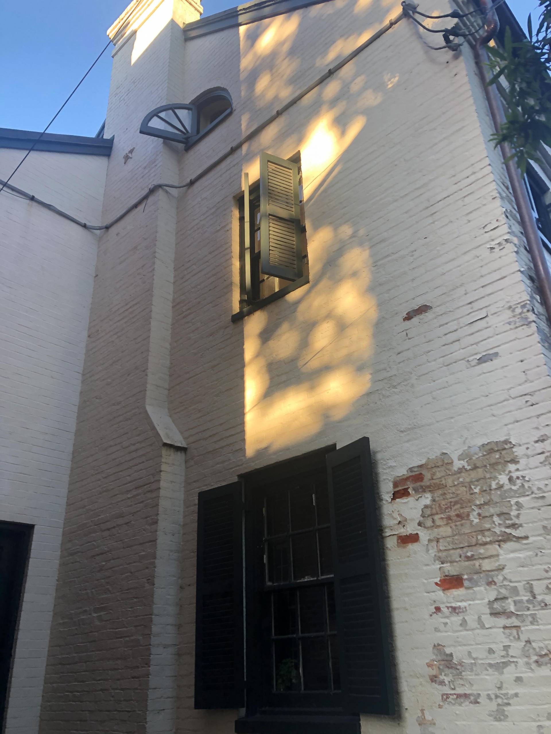 open window on brick house