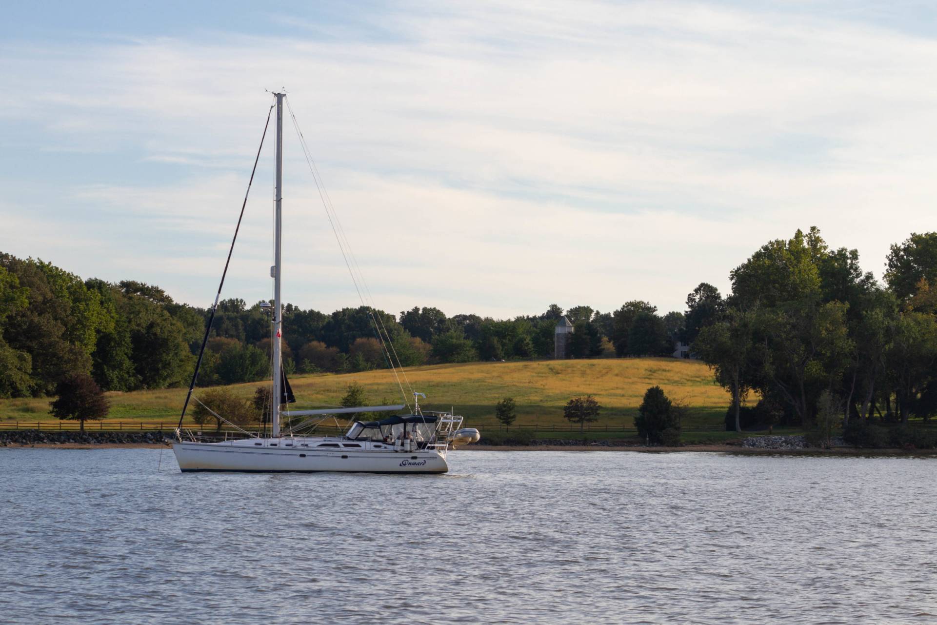 boat at anchor with field