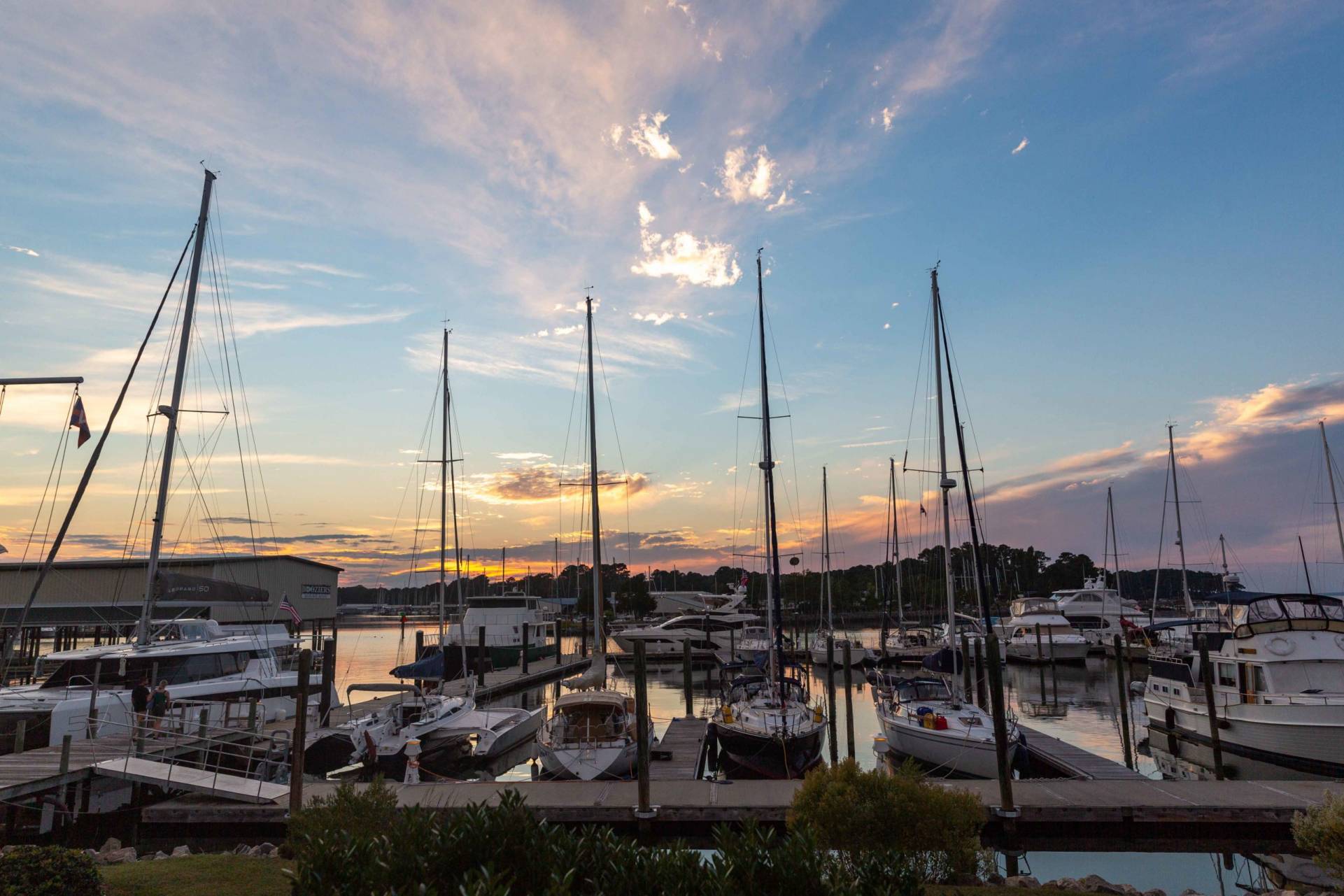 sunset with boats in a marina